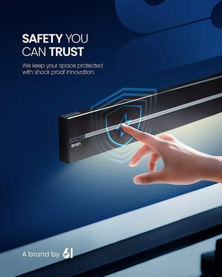 A finger touching the open rail of a SAGA power track, illustrating its touch-safe design